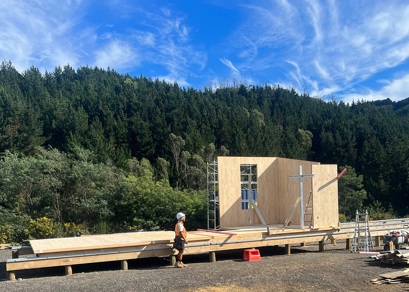 Three cross laminated timber  (CLT) panels assembled as walls of Te Whare-iti modular home.